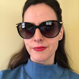 Burberry sunglasses.  Never been worn (except for this photo).  Brand new!